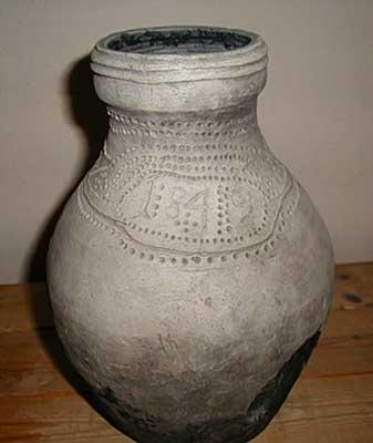 The clay jug for the beer dated to 1849. It was made by the potter F.M. Morozov in Verkhovye Village, Yavosemskaya volost (now the Tikhvin district)